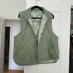 Green quilted puffer vest.